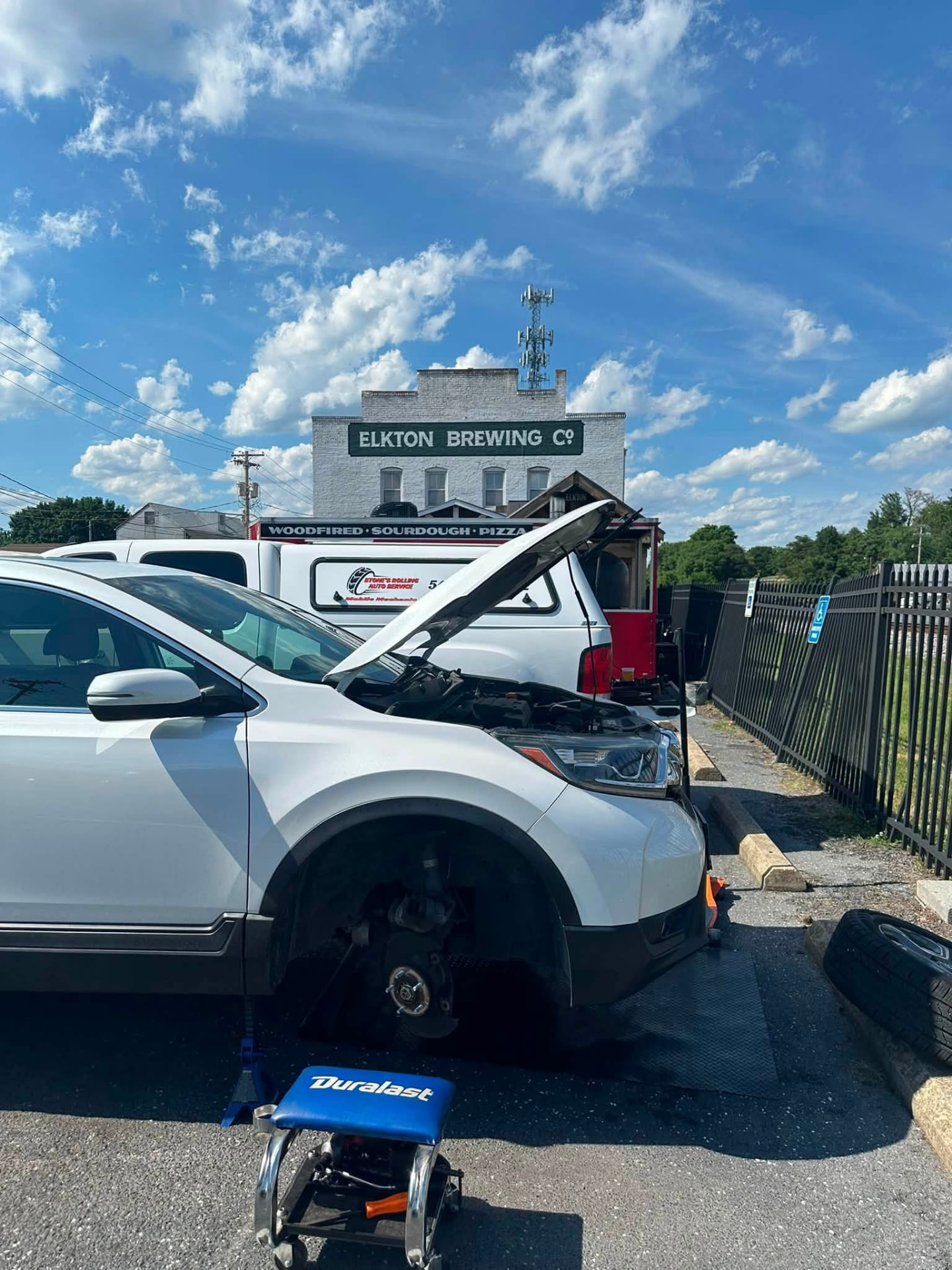 Vehicle with the hood up during on-site service